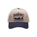 Outboard Legacy Hat in Skiff (navy brim, navy stitch) with embroidered Raised On It skiff logo and Faith Family Freedom