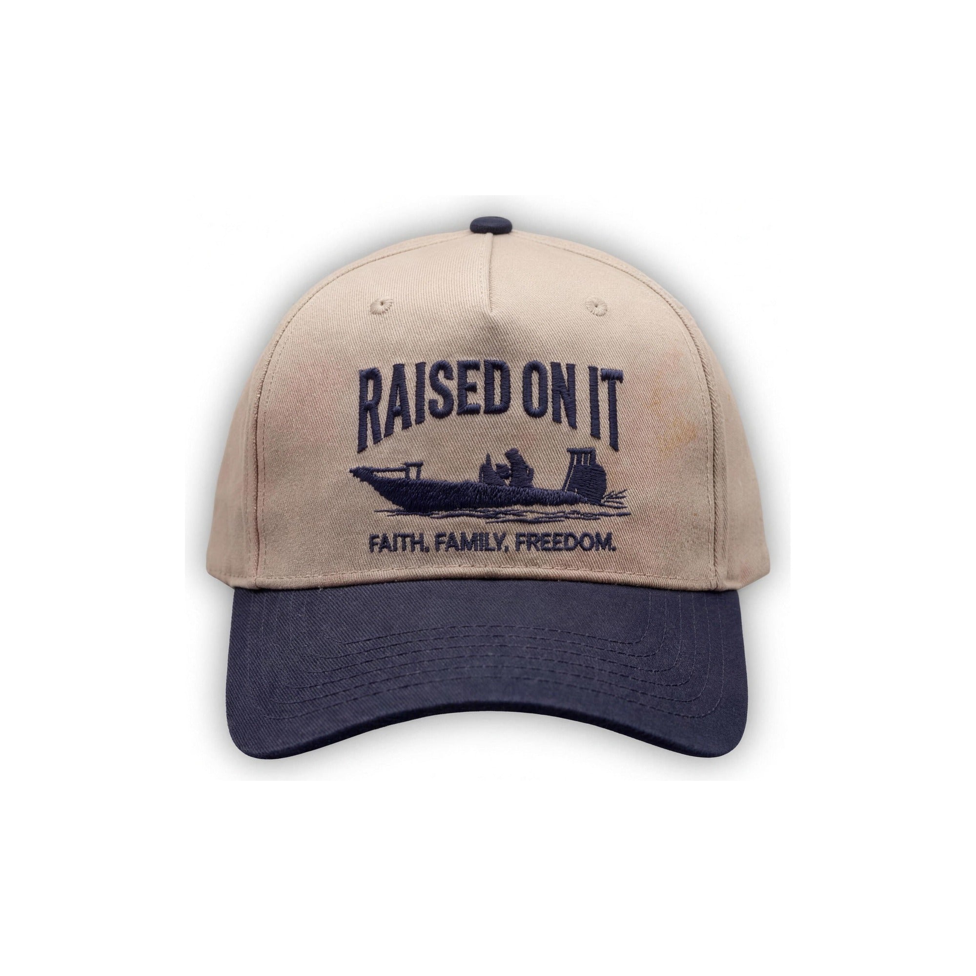 Outboard Legacy Hat in Skiff (navy brim, navy stitch) with embroidered Raised On It skiff logo and Faith Family Freedom