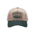 Outboard Legacy Hat in Mudboat (green brim, green stitch) with embroidered Raised On It mud boat logo and Faith Family Freedom